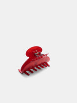 The Large Round Claw is a red plastic hair clip with a spring mechanism, inspired by handcrafted France acetate designs, displayed on a plain white background.