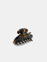 The Large Round Claw is a tortoiseshell-patterned acetate hair clip with a spring hinge, handcrafted in France and shown on a white background.