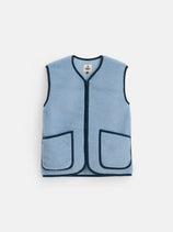 Coldbreaker Standard Vest in light blue features a sleeveless fleece design with two front pockets and contrasting navy blue trim. This vest, crafted in the signature Coldbreaker tradition, includes a front zipper and a label near the neckline. Ideal for layering over your favorite unisex sweater or Irish wool knit, it is showcased against a plain white background.
