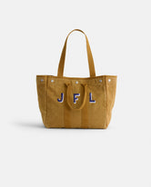 The Perfect Weekday Tote is a tan canvas cotton bag featuring two sturdy handles, button accents along the top edge, and blue and white stitched JFL initials on the front—making it an ideal choice for anyone who appreciates classic, monogrammable totes with a personalized touch.