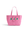 Introducing the Memorial Sloan Kettering Cancer Center × Alex Mill Perfect Weekday Tote—a personalized pink bag featuring two sturdy handles and bold green “BAM” lettering on the front. Set against a plain white background, this standout tote is perfect for supporting breast cancer research or expressing your unique style.