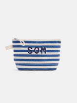 The Perfect Canvas Pouch in Stripe is a personalized bag with blue and white horizontal stripes, "SOM" initials in dark blue, a beige zipper, and a small beige fabric handle on the side.